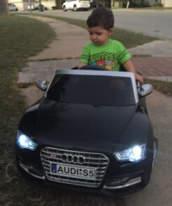 Roadster Ride On Kids Car w/Remote Control for Kids | 12V Power Battery Licensed Kid Car to Drive with 3 Speeds, LED Lights, Dining Table, Leather Seat 30 610yP1 vEZL