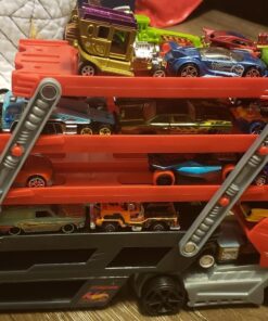 Hot Wheels Playset with Hw MEGA Hauler Toy Truck & 1:64 Scale Car, Stores 50+ Vehicles, Expands to 6 Levels red 43 61LRmy2Ki3L
