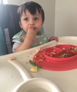 ezpz Mini Mat (Coral) - 100% Silicone Suction Plate with Built-in Placemat for Infants + Toddlers - First Foods + Self-Feeding - Comes with a Reusable Travel Bag - 6 Months+ Coral 36 61Q7KSGgB5L