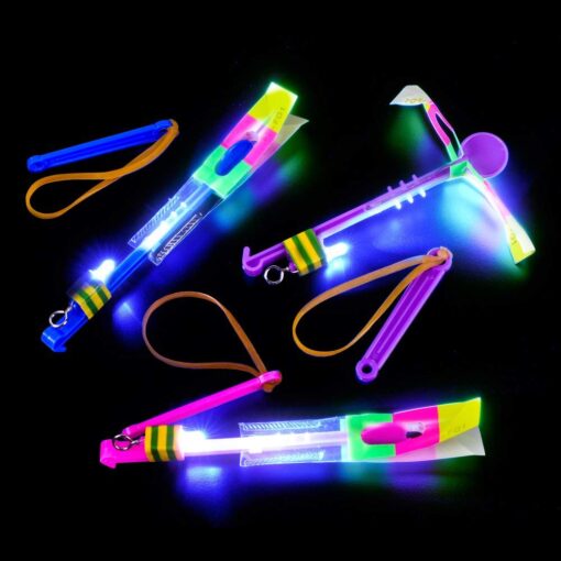 Dozen Light Up LED Slingshot Style Flying Helicopter Toy