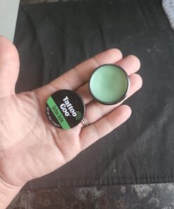 Tattoo Goo Original Travel Size Tattoo After Care, Natural Tattoo Balm with Beeswax and Cocoa Butter, Soothing Tattoo Ointment and Brightening Care, .32 oz; Packaging may vary 25 61tZGRNsSL