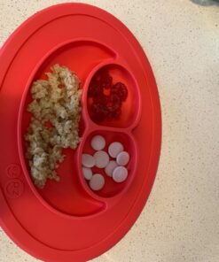 ezpz Mini Mat (Coral) - 100% Silicone Suction Plate with Built-in Placemat for Infants + Toddlers - First Foods + Self-Feeding - Comes with a Reusable Travel Bag - 6 Months+ Coral 38 719oZW0z3UL