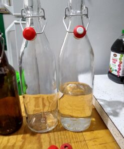 Bormioli Rocco Giara Swing Top Bottles 33 ¾ Ounce-4 Pack Round Clear Glass Grolsch Flip Top Bottle With Stopper, for Beverages, Smoothies, Kefir, Beer, Soda, Juicing, Kombucha, Water, Milk and Vinegar 4 Pack 31 71Z6QAec7IL