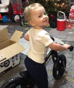 Strider 12” Sport Bike - No Pedal Balance Bicycle for Kids 18 Months to 5 Years - Includes Safety Pad, Padded Seat, Mini Grips & Flat-Free Tires - Tool-Free Assembly & Adjustments STRIDER Black 29 71lxSpGtWL 1