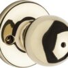 Kwikset Polo Bed/Bath Knob in Polished Brass Standard Packaging