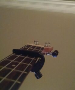 D'Addario Accessories Ukulele Pro Capo - For Soprano, Concert, Tenor, Baritone Ukuleles - 4 String Ukulele Capo - Micrometer Tension Adjustment for Buzz-Free, In-Tune Performance - Black 1 Pack 35 71uSWHsauKL