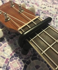 D'Addario Accessories Ukulele Pro Capo - For Soprano, Concert, Tenor, Baritone Ukuleles - 4 String Ukulele Capo - Micrometer Tension Adjustment for Buzz-Free, In-Tune Performance - Black 1 Pack 38 71yLXLElWTL