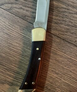 Buck Knives 110 Folding Hunter Lock-back Knife, Brass Bolsters, Ebony Handles, 3-3/4" 420HC Blade with Leather Sheath Classic 3.75" 52 81VAmsOZjQL
