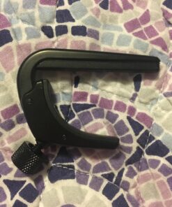 D'Addario Accessories Ukulele Pro Capo - For Soprano, Concert, Tenor, Baritone Ukuleles - 4 String Ukulele Capo - Micrometer Tension Adjustment for Buzz-Free, In-Tune Performance - Black 1 Pack 39 81cvzrTmcoL