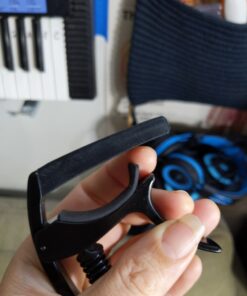 D'Addario Accessories Guitar Capo – NS Tri Action - For 6-String Electric and Acoustic Guitars – Micrometer Tension Adjustment for Buzz-Free, In-Tune Performance – Integrated Pick Holder, Black (PW-CP-09) Tri-Action Capo 28 81sPeus2eL