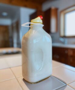 The Dairy Shoppe Heavy Glass Milk Bottles - Jugs with Lids and Silicone Pour Spouts - Clear Milk Containers for Fridge - Reusable Glass Milk Jug Dispenser - Made in USA (64 oz, 2 Pack) 64 oz 35 61X2qXlRJsL