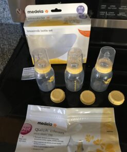 Medela Breast Milk Storage Bottles, 3 Pack of 5 Ounce Breastfeeding Bottles with Slow Flow Nipples, Lids, Wide Base Collars, and Travel Caps, Made Without BPA 3 Count (Pack of 1) 33 710JolwkuuL