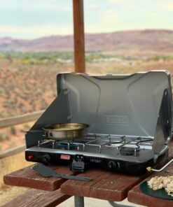 Coleman Triton+ 2-Burner Propane Camping Stove, Push-Button Instant Ignition, Portable Camp Grill, Adjustable Burners, Wind Guards, 22,000 Total BTUs of Power, Beach Cookouts, Backyard BBQ, Tailgating Silver 67 711AmzkcfUL