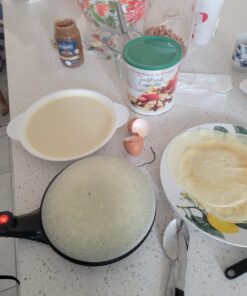 Crepe Maker - Cooks Crepes Bacon, Roti, Tortillas & Pancakes - Nonstick Cooktop - 8-inch Cook Area with On/Off Switch, Automatic Temperature Control & Cool-Touch Handle - Includes Whisk & Spatula 34 7165jPws YL