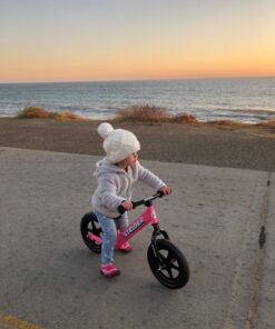 Strider 12” Classic Bike - No Pedal Balance Bicycle for Kids 18 Months to 3 Years - Includes Built-In Footrest, Handlebar Grips & Flat-Free Tires Pink 29 718EfyrturL