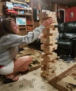 Yard Games Giant Tumbling Timbers with carrying case starts at 2.5-feet tall and builds to 5-feet 30 Inch Natural 38 71Cnz3phLL