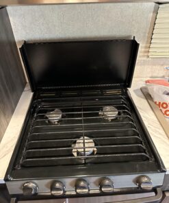 Camco Camper/RV Stove Top Cover | Features Hinged Design for Easy Access to Front Burners & Fits Most 3 or 4 Burner RV/Boat Stoves | Crafted of 20-Gauge Steel w/Powder-Coated Finish | Black (43554) 35 71NXSEYra0L 1