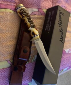 Uncle Henry 153UH Golden Spike Fixed Blade Knife with 5in High Carbon S.S. Blade, Staglon Handle, Sharpening Stone, Full Tang, and Leather Sheath for Hunting, Skinning, Camping, and Outdoors 153UH Golden Spike (Box) 35 71SDv252vRL
