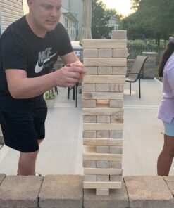 Yard Games Giant Tumbling Timbers with carrying case starts at 2.5-feet tall and builds to 5-feet 30 Inch Natural 34 71W0tjT3hgL