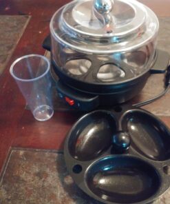 Hamilton Beach Electric Hard Boiled Egg Cooker, 3-in-1: Boiled Egg Cooker, Poacher & Omelet Maker, Can Hold 7 Eggs, Black with Silver Knob (25500) 39 71YyFlTKvL