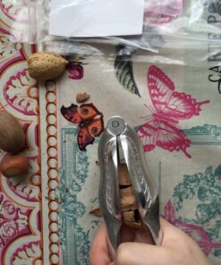 Magic Nutcracker Tool Works in Seconds. No Mess. Works on Walnuts, Almonds, Pecans, Hazelnuts. Great to Use As a Lemon Lime Squeezer. 50 81Ue9HzGviL