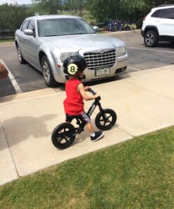 Strider 12” Sport Bike - No Pedal Balance Bicycle for Kids 18 Months to 5 Years - Includes Safety Pad, Padded Seat, Mini Grips & Flat-Free Tires - Tool-Free Assembly & Adjustments STRIDER Black 30 81WqZkD87tL 1