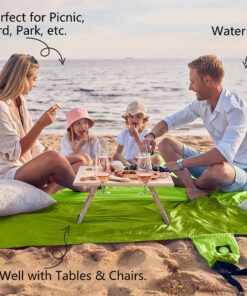 WEKAPO Beach Blanket Sandproof, Extra Large Beach Mat, Big & Compact Sand Free Mat Quick Drying, Lightweight & Durable with 6 Stakes & 4 Corner Pockets Green 9x10 FT (1~8 person) 15 81vybClHPtL