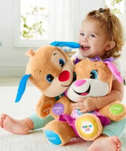 Fisher-Price Laugh & Learn Baby & Toddler Toy Smart Stages Sis With Pink Skirt and Purple Bows, Interactive Plush Dog with Music Lights & Learning Content for Ages 6+ Months Sis - Pink 38 91r LKBm5mL