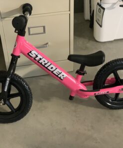 Strider 12” Classic Bike - No Pedal Balance Bicycle for Kids 18 Months to 3 Years - Includes Built-In Footrest, Handlebar Grips & Flat-Free Tires Pink 28 B10unSGDZzS