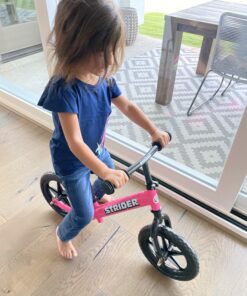 Strider 12” Classic Bike - No Pedal Balance Bicycle for Kids 18 Months to 3 Years - Includes Built-In Footrest, Handlebar Grips & Flat-Free Tires Pink 25 B151eijRrHS